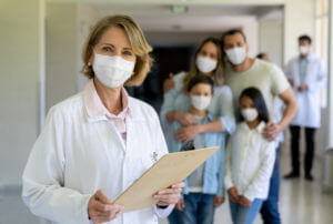 Family doctor wearing a facemask at the hospital during the COVID-19 pandemic