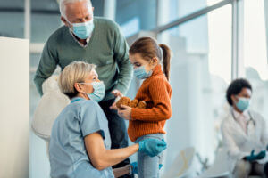 Female doctor talking to a young child
