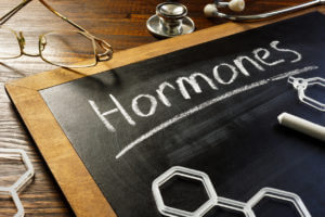 Hormones written on a black board