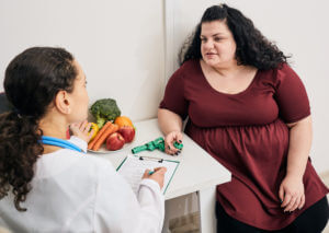 A fat Woman Consulting doctor for weight loss