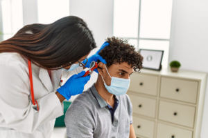 Young Family Doctor Analysing patient problem