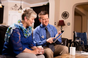 Concierge doctor visits senior woman at home